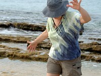 DSC 4574  Linda maintaining her balance on slippery rocks on Seven Mile Beach