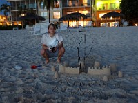 DSC 4767  Teagan by her traditional New Year's Day sand castle