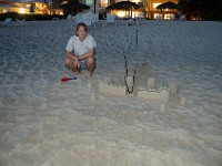 DSC 4770  Teagan by her traditional New Year's Day sand castle