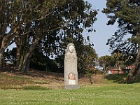 DSC 2151  A statue on the field at Fort Mason : flowers