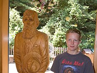 DSC 2242  Teagan poses with a carving of John Muir : flowers