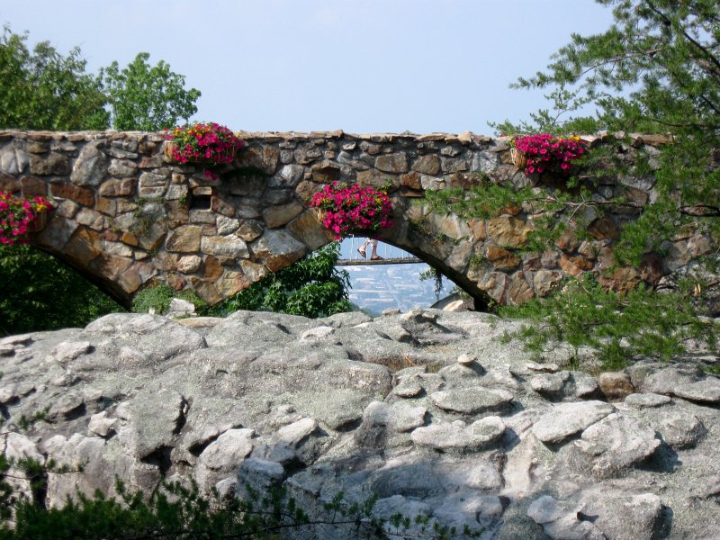 IMG_3909.jpg - People walking on the Hanging Bridge seen through the Stone Bridge