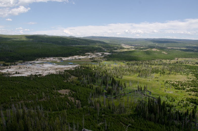 _DSC7266.jpg - View from overlook on Mystic Falls Loop; Biscuit Basin (left), Upper Geyser Basin (left-center), Old Faithful area (center).